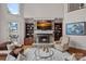 Inviting living room featuring a stone fireplace, built-in shelves, and plush seating arrangement at 130 Brick Kiln Way, Mooresville, NC 28117