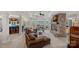 Spacious living room with a stone fireplace, lake views, and comfortable seating at 130 Brick Kiln Way, Mooresville, NC 28117