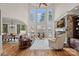 Bright and spacious living room featuring large windows, a fireplace, and elegant furnishings at 130 Brick Kiln Way, Mooresville, NC 28117