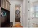 View of entry featuring bench and storage leading to a decorative powder room at 130 Brick Kiln Way, Mooresville, NC 28117