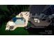 Backyard aerial view of a private pool and patio area of this luxury home at 130 Brick Kiln Way, Mooresville, NC 28117