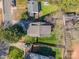 Overhead shot of a house with a well-maintained roof, a green backyard, and mature trees at 130 N Smallwood Pl, Charlotte, NC 28216