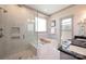 The primary bathroom features a glass enclosed shower and soaking tub at 130 N Smallwood Pl, Charlotte, NC 28216