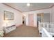 Charming bedroom featuring pink trim, a crib, and ample natural light perfect for a cozy Bedroom at 130 N Smallwood Pl, Charlotte, NC 28216
