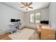 Bedroom provides plenty of space and natural light with a ceiling fan and large windows at 130 N Smallwood Pl, Charlotte, NC 28216