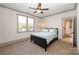 Bedroom with large windows offering natural light next to an open doorway to the Bedroom at 130 N Smallwood Pl, Charlotte, NC 28216