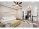 Bonus room features a ceiling fan, large windows, and a seating area with a sofa at 130 N Smallwood Pl, Charlotte, NC 28216