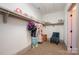 Walk-in closet with shelving, clothing rods and ample room for storage with a chair for changing at 130 N Smallwood Pl, Charlotte, NC 28216