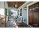 Cozy front porch with comfortable seating, ceiling fan, and wood ceiling at 130 N Smallwood Pl, Charlotte, NC 28216