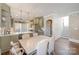 This muted green kitchen and dining area features stainless steel appliances and direct access to the stairway at 130 N Smallwood Pl, Charlotte, NC 28216