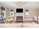 Inviting living space with a fireplace, large windows, and hardwood flooring at 130 N Smallwood Pl, Charlotte, NC 28216