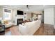 Comfortable living room with a fireplace, hardwood floors, and an open kitchen view at 130 N Smallwood Pl, Charlotte, NC 28216