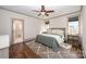 This main bedroom features wooden floors, ensuite bathroom, and neutral tones at 130 N Smallwood Pl, Charlotte, NC 28216