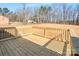 Wooden deck and backyard featuring mature trees in the distance at 1313 Springdale Park Dr, Lincolnton, NC 28092