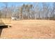 Expansive backyard with potential for gardening or recreation, featuring a small wooden deck on the side at 1313 Springdale Park Dr, Lincolnton, NC 28092