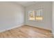 Bedroom featuring wood-look flooring and a window that offers natural light and outdoor views at 1313 Springdale Park Dr, Lincolnton, NC 28092