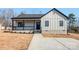 Charming single-story home with a welcoming front porch and modern design elements at 1313 Springdale Park Dr, Lincolnton, NC 28092