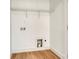 Small laundry room featuring wood-look flooring and washer and dryer hookups at 1313 Springdale Park Dr, Lincolnton, NC 28092
