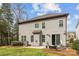 Back of home features a patio with outdoor seating, a grill, and a grassy lawn at 13725 Laughing Gull Dr, Charlotte, NC 28278