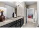 Elegant bathroom with a double vanity, granite countertop, and modern fixtures at 13725 Laughing Gull Dr, Charlotte, NC 28278