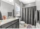 Clean bathroom featuring a shower, sink, and toilet at 13725 Laughing Gull Dr, Charlotte, NC 28278