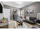 Relaxing bedroom with a massage table, contemporary sofa, and soft textures, perfect for unwinding at 13725 Laughing Gull Dr, Charlotte, NC 28278