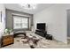 Bedroom showing a chaise lounge, a TV, and modern lighting, complete with neutral carpet at 13725 Laughing Gull Dr, Charlotte, NC 28278