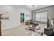 Well-lit bedroom showcasing a chaise lounge and view into another room, all with neutral carpet at 13725 Laughing Gull Dr, Charlotte, NC 28278