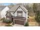 Exterior elevation of two-story home features manicured lawn and an attached two-car garage at 13725 Laughing Gull Dr, Charlotte, NC 28278