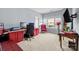 Bright home office with desk, computer, and natural light, featuring modern decor and comfortable seating at 13725 Laughing Gull Dr, Charlotte, NC 28278