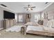 Spacious main bedroom featuring a large bed, flat screen TV, and dual windows for natural light at 13725 Laughing Gull Dr, Charlotte, NC 28278