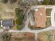 Aerial shot of a house surrounded by bare trees and a weathered outbuilding at 1601 Mooresville Rd, Salisbury, NC 28147