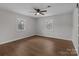 Cozy bedroom featuring hardwood floors and a ceiling fan at 1601 Mooresville Rd, Salisbury, NC 28147
