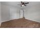 Bedroom with hardwood floors, white trim, and double door closet at 1601 Mooresville Rd, Salisbury, NC 28147