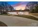 Charming one-story home with a red front door, brick walkway and a spacious driveway at 1601 Mooresville Rd, Salisbury, NC 28147