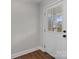 Close up of the front door showing natural lighting entering through a window in the door at 1601 Mooresville Rd, Salisbury, NC 28147