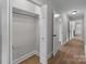 Hallway with hardwood floors leading to an open closet and other rooms at 1601 Mooresville Rd, Salisbury, NC 28147