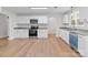Charming kitchen with updated appliances, granite countertops, and white cabinets offering plenty of storage space at 1601 Mooresville Rd, Salisbury, NC 28147