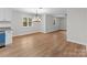 Eat-in kitchen with hardwood floors, a hanging light fixture, with natural lighting at 1601 Mooresville Rd, Salisbury, NC 28147