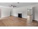 Cozy living room featuring a fireplace, wood flooring, and neutral wall colors at 1601 Mooresville Rd, Salisbury, NC 28147