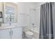 Clean bathroom featuring white subway tiles in the shower and modern fixtures at 1659 Duckworth Ave, Charlotte, NC 28208