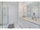 Bathroom with dual sinks, white subway tile shower, and modern fixtures at 1659 Duckworth Ave, Charlotte, NC 28208
