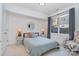 Well-lit bedroom with a mirror and cozy decor, offering a comfortable retreat at 1659 Duckworth Ave, Charlotte, NC 28208