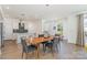 Dining room with modern lighting, hardwood floors, open to the kitchen and living area at 1659 Duckworth Ave, Charlotte, NC 28208