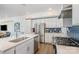 Open kitchen featuring stainless steel appliances, sleek countertops, and a modern backsplash at 1659 Duckworth Ave, Charlotte, NC 28208