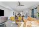 Open-concept living room flowing into dining area, with modern decor and hardwood floors at 1659 Duckworth Ave, Charlotte, NC 28208