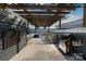 Spacious rooftop patio with pergola, outdoor kitchen, tv, grill and modern lounge seating at 1659 Duckworth Ave, Charlotte, NC 28208