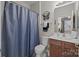 Bathroom featuring a shower with blue curtain, and a wood vanity cabinet at 1668 Onyx Rdg # 116, Fort Mill, SC 29708