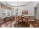 Elegant dining room featuring hardwood floors, tray ceilings, a chandelier and a large window at 1668 Onyx Rdg # 116, Fort Mill, SC 29708