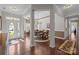The grand foyer flows to the dining room, with beautiful hardwood floors and natural light at 1668 Onyx Rdg # 116, Fort Mill, SC 29708